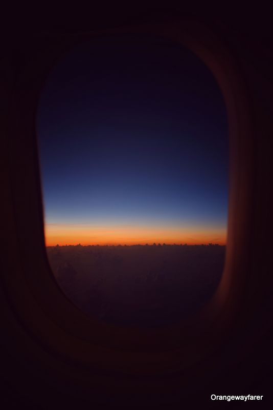 Sunrise as seen from flight window