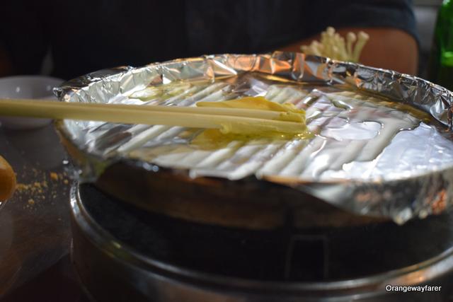 Use the butter: Step one to prepare the hotplates from Hanoi street