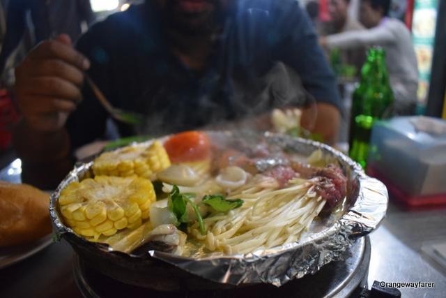 Wait till the steam comes up! Final step! Hot Plate at Hanoi Street Food