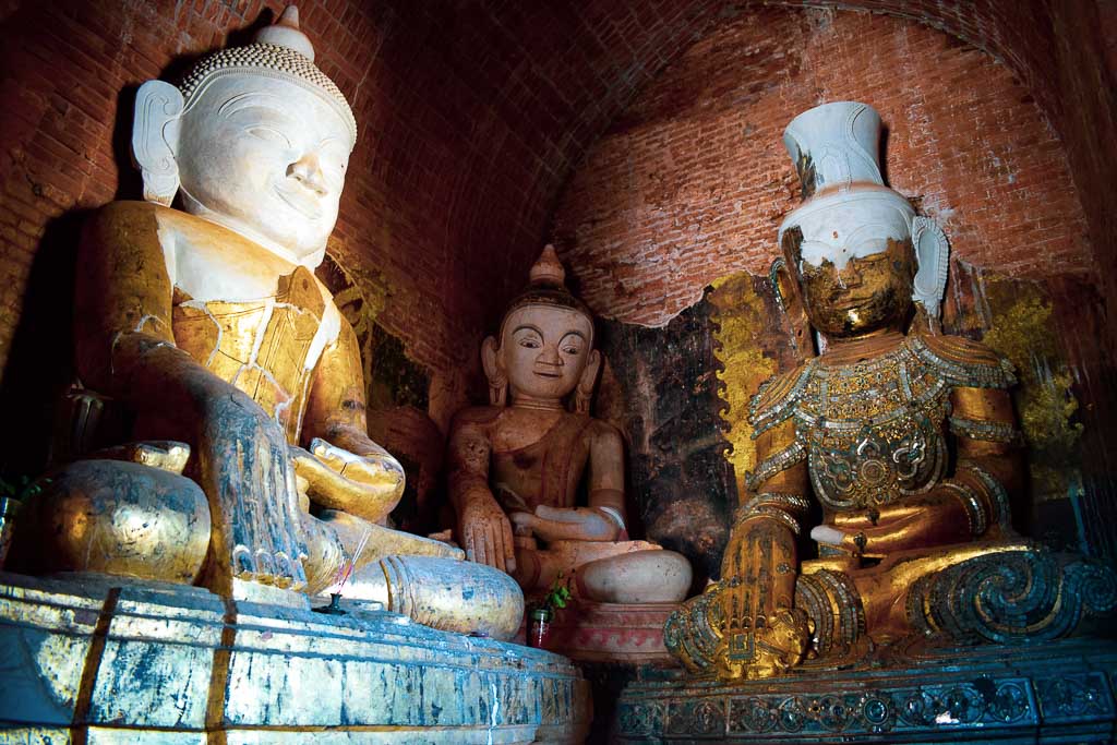 inside the temples of old Bagan: Murals and old Buddha statue