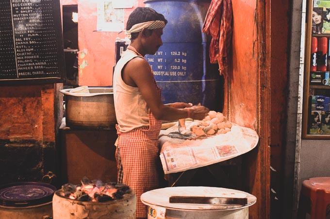 A man makes Ruti, Indian bread at Decker's Lane