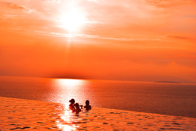 Sunset in Thailand. Infinity pool at Santhia Resort Koh Yai Noi