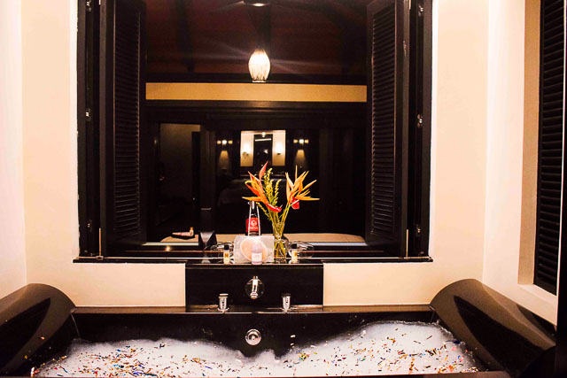 Bedroom with attached bathtub at taj madikeri resort & spa, coorg madikeri, karnataka