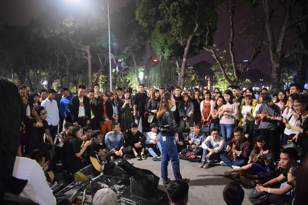 A weekend party going on among the locals by Hoan Kiem Lake