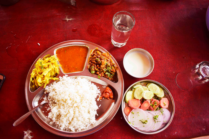 Eating a vegeterian thali at Dandeli. The meal was filling and delightful. 