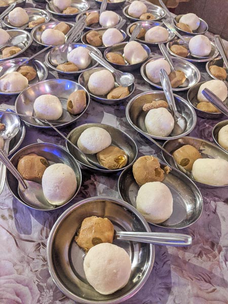 bengali wedding sweet thali with doi, rosogolla and nolen gurer sondesh: traditional bengali sweet