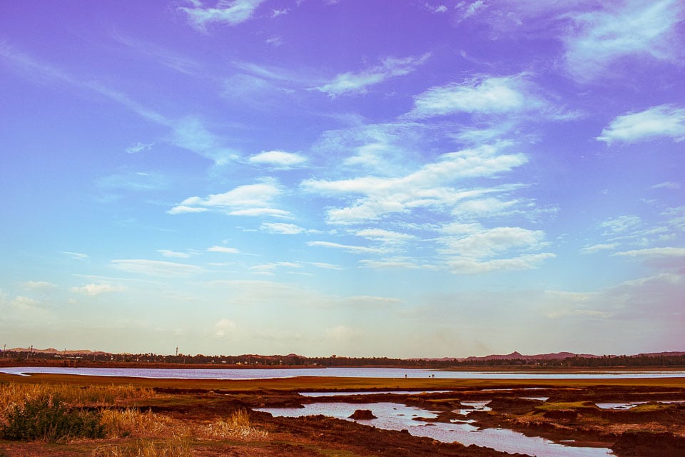 Sunset on a waterbody at hampi: offbeat things to do in Hampi