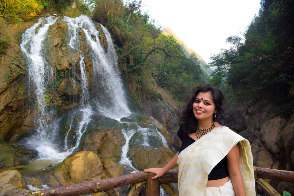 love waterfall in Sa pa- woman traveler from india in saree